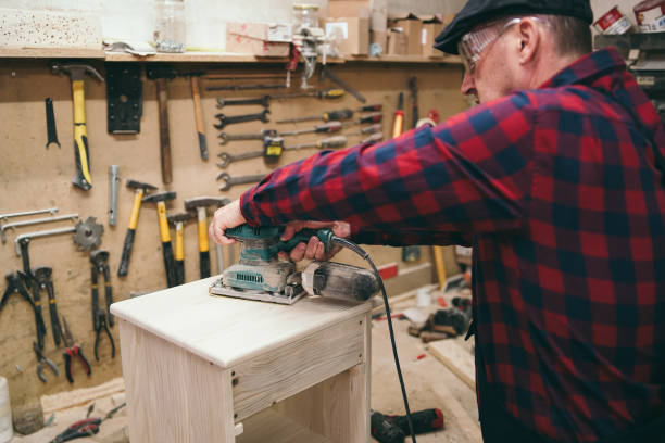 istock Carpenter restoring old furniture 1076861518