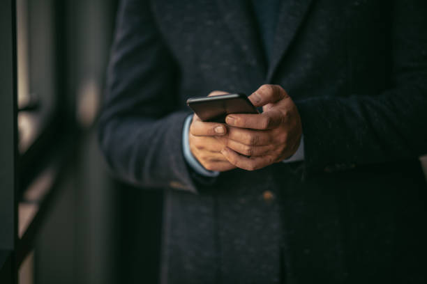 istock Close up of businessman typing message 1076866414