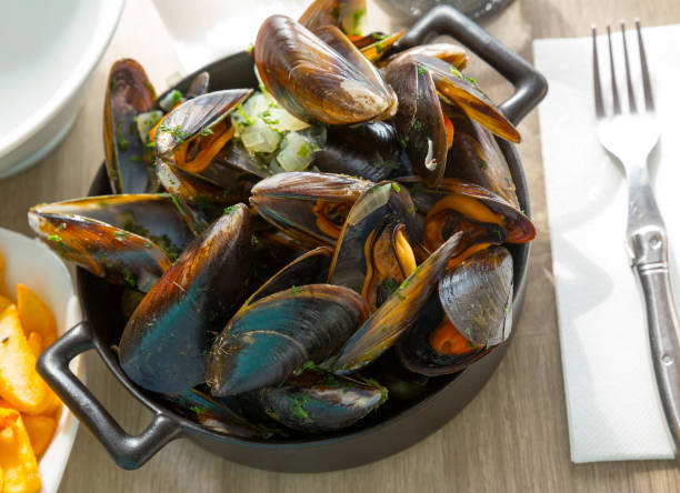 istock Fresh mussels served with onion sauce 1076875358