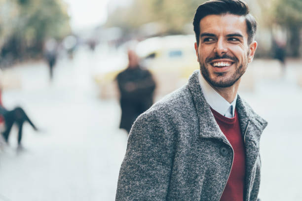 istock Portrait of smiling young man 1076877254
