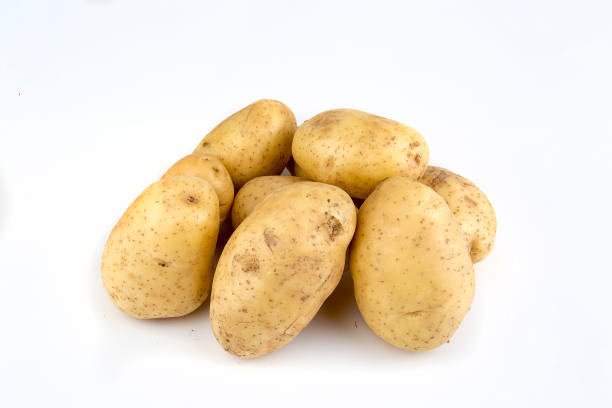 istock Fresh organic vegetables; potatoes on the white background. 1076882574