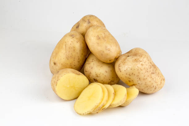 istock Fresh organic vegetables; potatoes on the white background. 1076882750