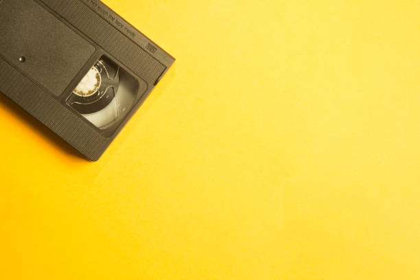 istock Video cassette isolated on yellow background. cassette with copy space 1076886968
