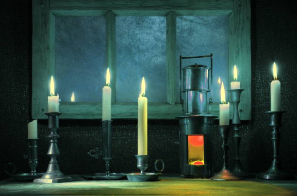 istock Burning candles,old candlestick and vintage ship lantern.Background with retro window frame.The holiday mood 1076889832