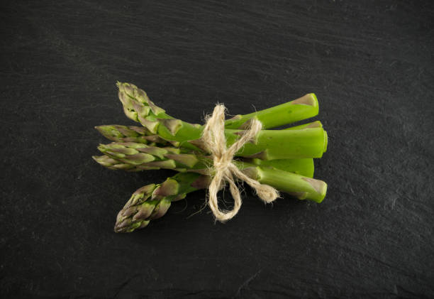 istock Bunch of Raw Garden Asparagus 1076893910