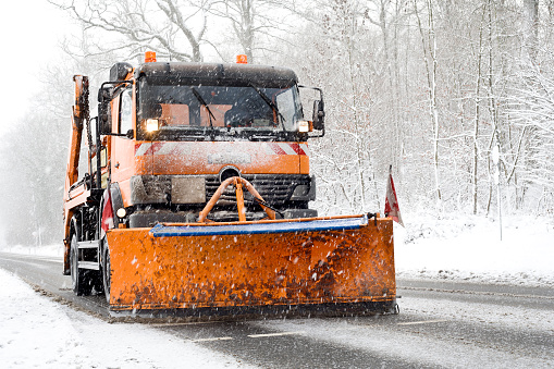 Snow plow truck - winter road conditions, heavy snowfall