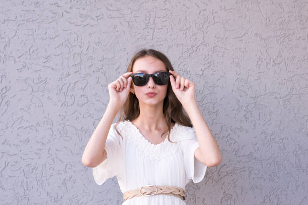 istock Young girl with sunglasses 1076924518