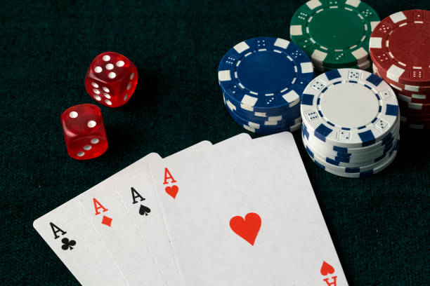 istock Person playing poker and looking at cards 1076924698