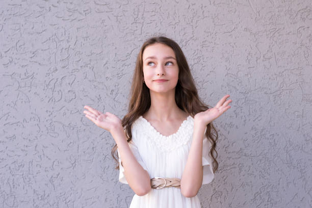 istock Dark-haired girl promoting something 1076927418