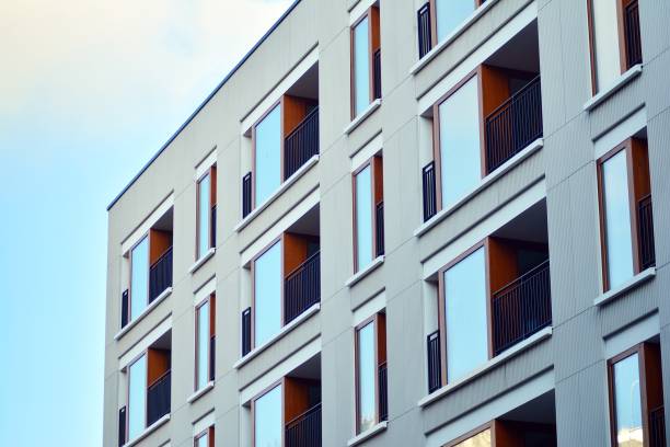 istock Modern apartment buildings on a sunny day with a blue sky. 1076932996