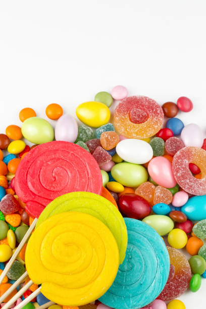 istock Colorful lollipops and different colored round candy. Top view. 1076934986
