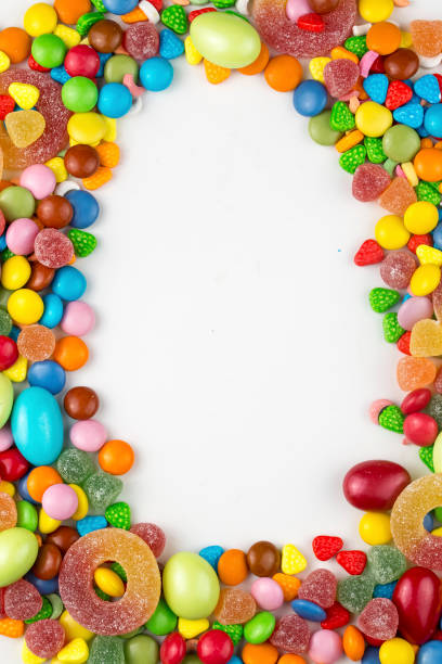 istock Colorful lollipops and different colored round candy. Top view. 1076934990