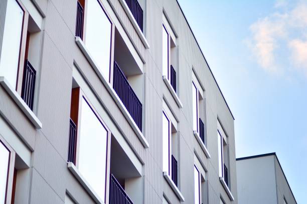 istock Modern apartment buildings on a sunny day with a blue sky. 1076935222