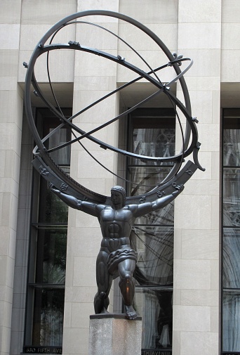 Atlas (by Lee Lawrie, 1937) is a bronze statue in front of Rockefeller Center within the International Building's courtyard in Midtown Manhattan, New York City, across Fifth Avenue from St. Patrick's Cathedral. The sculpture depicts the Ancient Greek Titan Atlas holding the heavens.