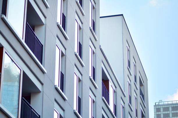 istock Modern apartment buildings on a sunny day with a blue sky. 1076938004