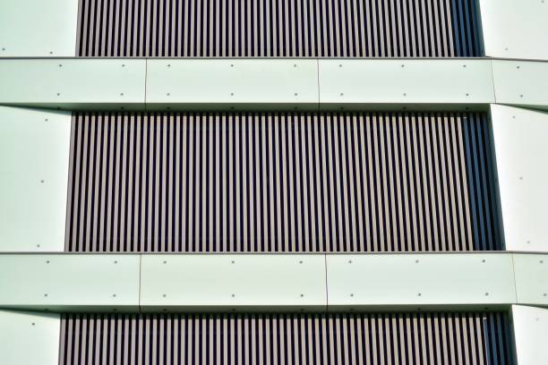 istock Modern office building facade abstract fragment, shiny windows in steel structure. 1076939614
