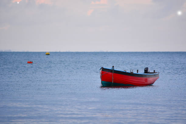 istock Fishing Boat on Twilight Sea 1076941858