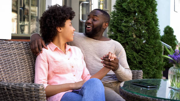 istock Smiling boyfriend and girlfriend enjoying romantic date, sitting cafe, relations 1076945280