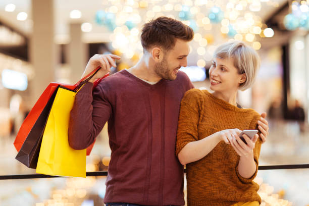 istock Happy couple shopping 1076945432