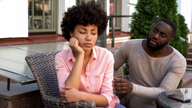 istock Conflict, unhappy girlfriend ignoring boyfriend, turned away, misunderstanding 1076945516
