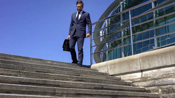 istock Male businessman having backache, going to work, radicular pain, slipped disc 1076946484