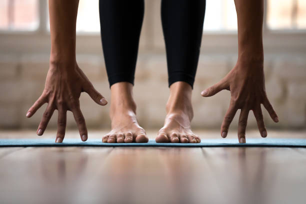 istock Sporty active woman practicing yoga, doing bend exercise, close up 1076946880