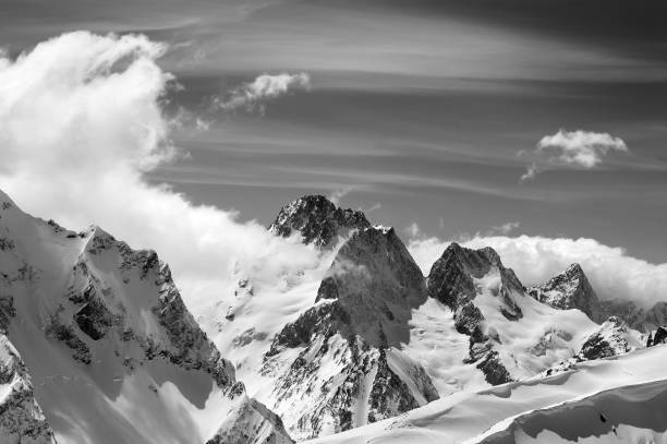 istock Winter mountains with snow cornice and sky with clouds in nice sun day 1076947166