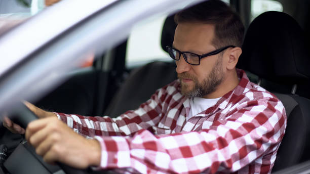 istock Tired man sitting in car suffering neck discomfort, spinal problem, cervicalgia 1076951030