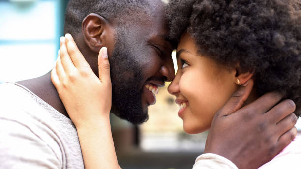 istock Couple nuzzling, romantic moments, relations togetherness, love affection 1076953666