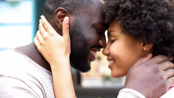 istock Happy couple nuzzling, romantic moments, relation togetherness, love affection 1076953722