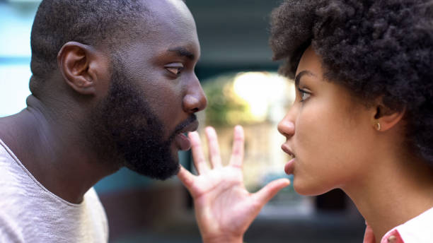 istock Man and woman talking aggressively outdoor, relation difficulties, conflict 1076953896