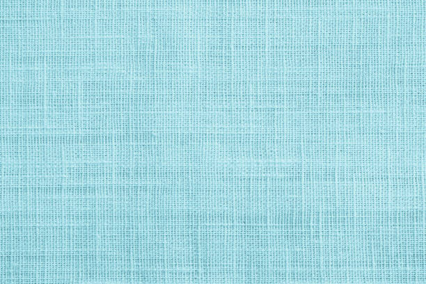 istock Jute hessian sackcloth canvas sack cloth woven texture pattern background in teal cyan blue color 1076954548