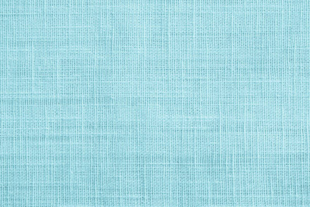 Jute hessian sackcloth canvas sack cloth woven texture pattern background in teal cyan blue color Jute hessian sackcloth canvas sack cloth woven texture pattern background in teal cyan blue color flax weaving stock pictures, royalty-free photos & images