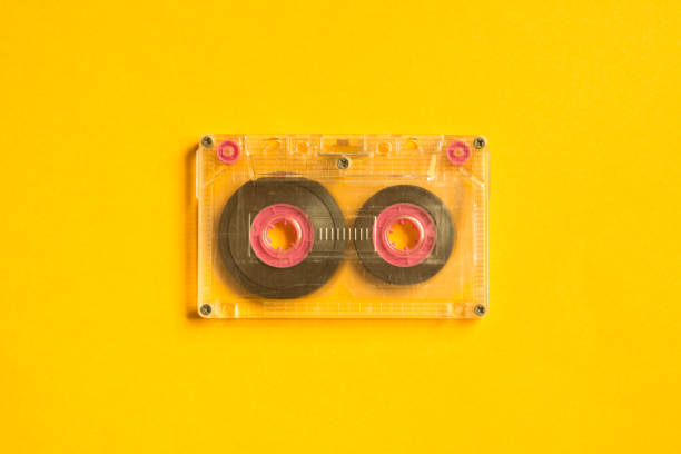 istock Retro cassette tape on the yellow background. copy space 1076966616