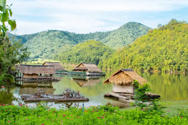 The wooden raft in the water reservoirs and mountain views.