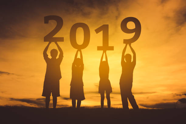 istock Family happy new year 2019 silhouette. 1076999616