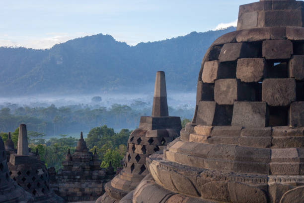 istock Borobudur at dawn with a foggy background 1077012006