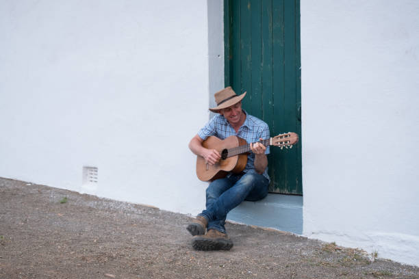 istock Cowboy relaxing with his guitar 1077017402
