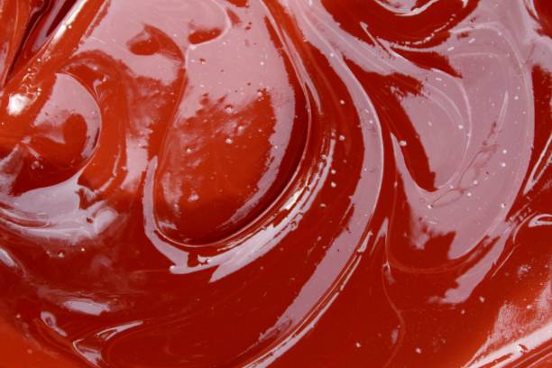 istock Dark Red abstract background with wave pattern.This is a mixture of wet cement concrete and red oxide Cement Color Powder. Abstract, background and textures 1077026428