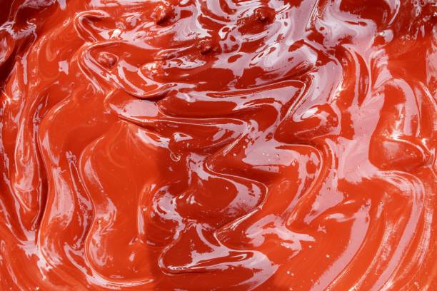 istock Dark Red abstract background with wave pattern.This is a mixture of wet cement concrete and red oxide Cement Color Powder. Abstract, background and textures 1077026578