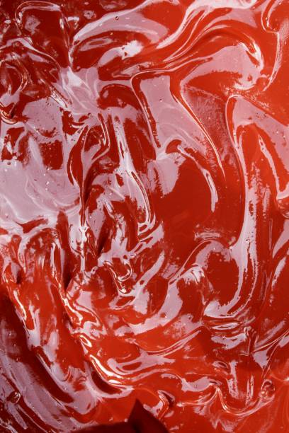 istock Dark Red abstract background with wave pattern.This is a mixture of wet cement concrete and red oxide Cement Color Powder. Abstract, background and textures 1077026660