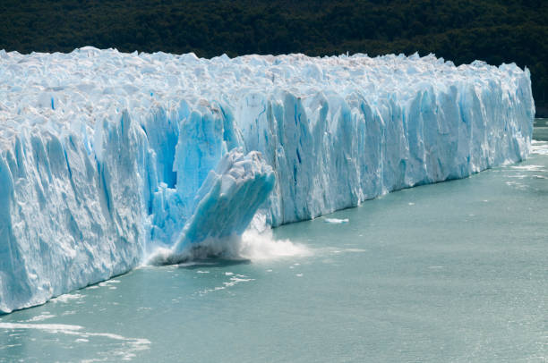 Ice Calving at the Perito Moreno Glacier A giant piece of Ice breaks off the Perito Moreno Glacier in Patagonia, Argentina climate change stock pictures, royalty-free photos & images