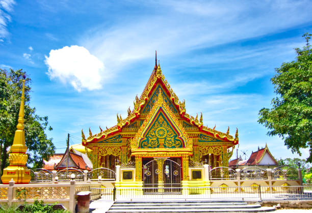 Wat Don Damrong Tham Temple Wat Don Damrong Tham Temple, a place where the Thai people worship. White clouds and blue sky are the background. Located in Chonburi in Thailand. wat tham sua stock pictures, royalty-free photos & images
