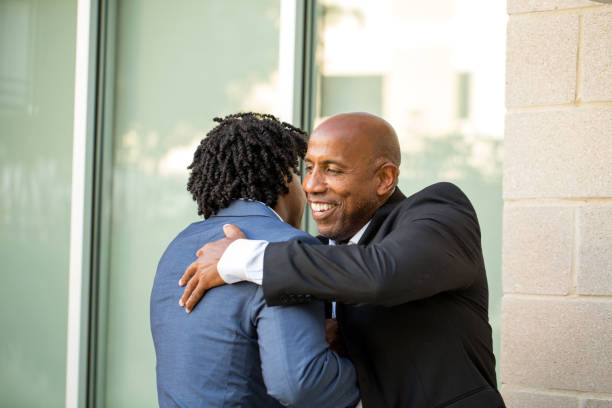 istock African American businessman shaking hands and greeting each other 1077033128