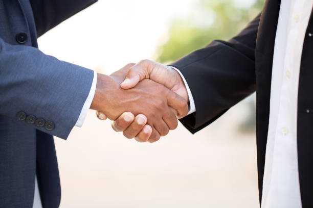 istock African American businessmen shaking hands 1077033250