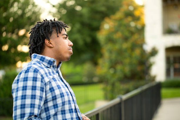istock Young African American man in deep thought. 1077033288