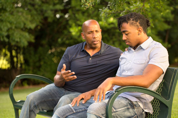 african american father and his son. - portrait men senior adult depression imagens e fotografias de stock