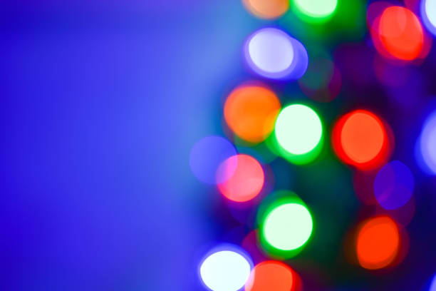 istock Christmas and new year decoration (background). Abstract blurred bokeh blinking garland. 1077038208