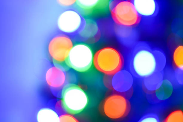 istock Christmas and new year decoration (background). Abstract blurred bokeh blinking garland. 1077038642