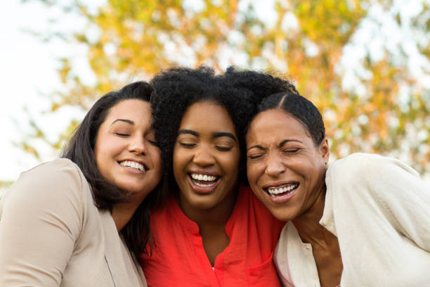 istock Multi-ethnic group of women laughing and talking. 1077040630